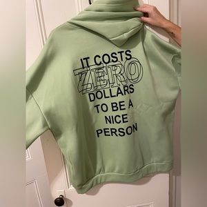 Oversized Hoodie, saying “It costs zero dollars to be a nice person” on back